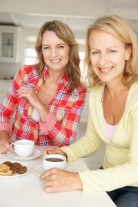 bigstock-Mid-age-women-chatting-over-co-23244707