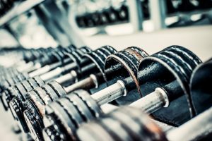 bigstock-Sports-dumbbells-in-modern-spo-82840448